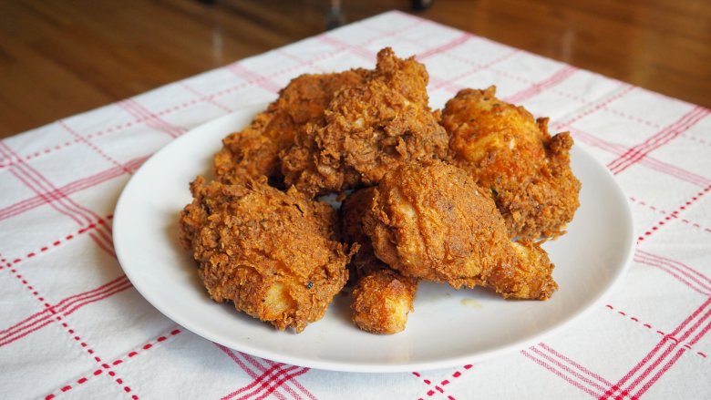 A delicious plate of fried chicken on a table,