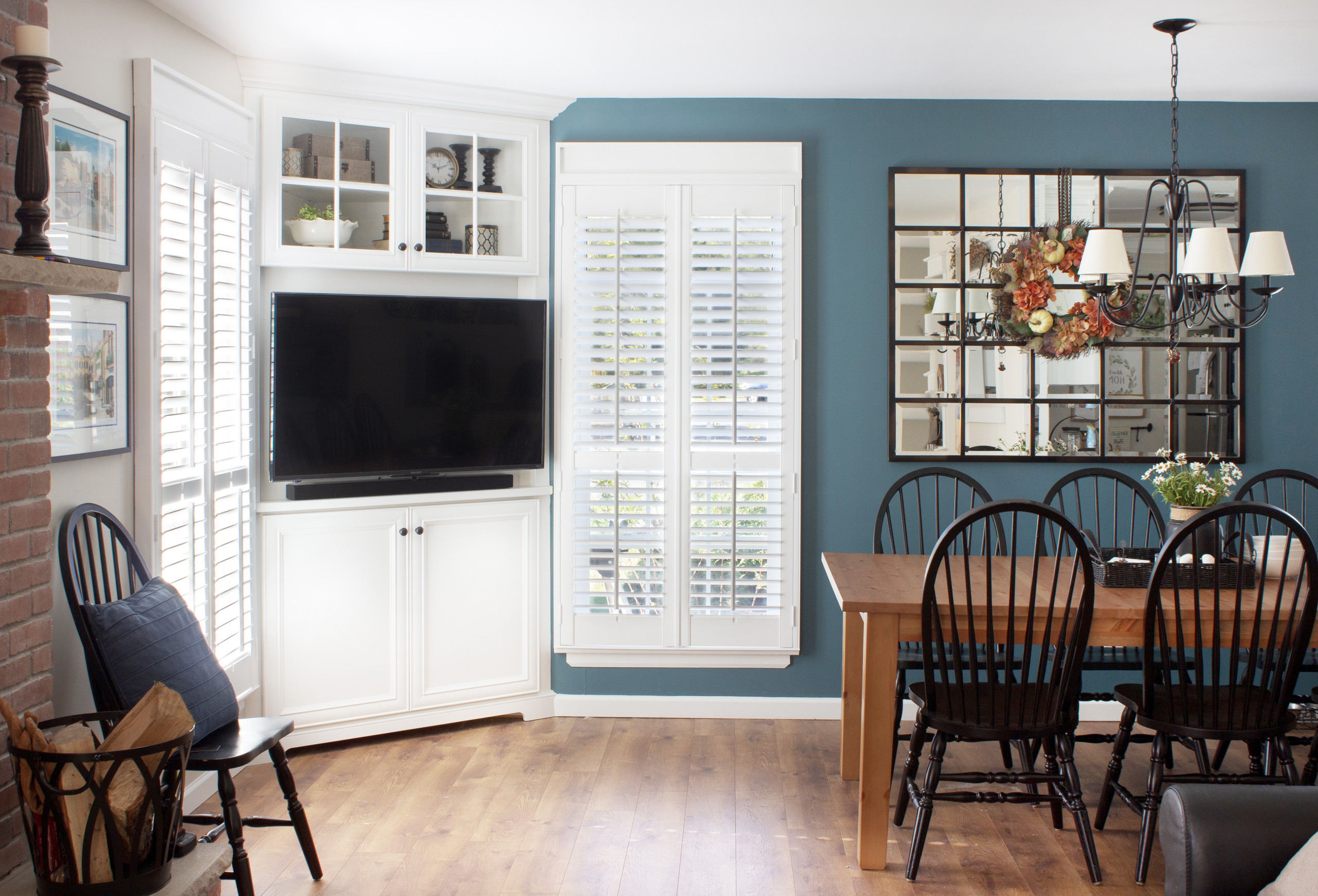 A wooden table with chairs, providing seating arrangements for saving spaces