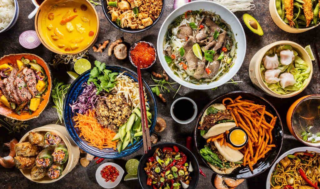 A colorful assortment of food displayed in bowls