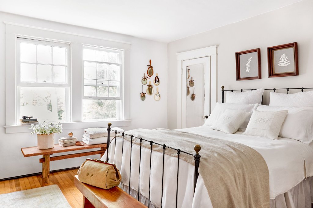 Minimalist white bedroom with bed