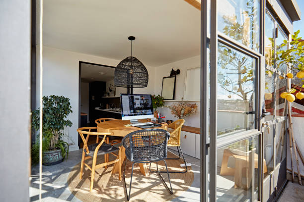 A versatile kitchen and dining area with a glass door, offering a seamless blend of functionality and style